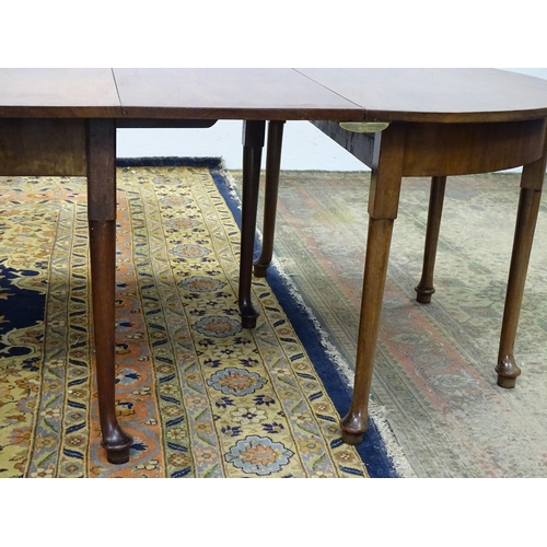 1531 - A 19thC mahogany D - end dining table comprised of two demi lune tables and a drop flap table raised... 