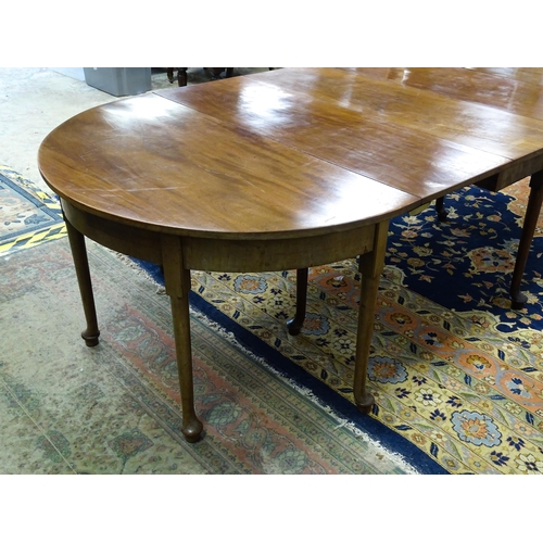 1531 - A 19thC mahogany D - end dining table comprised of two demi lune tables and a drop flap table raised... 