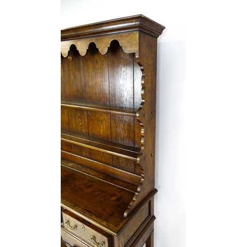 1532 - A late 20thC Bylaw & Co dresser with a graduated two tier plate rack having a moulded cornice and sh... 