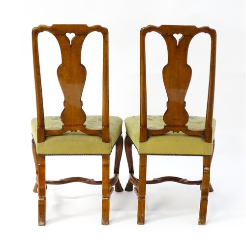 1536 - A pair of early / mid 18thC Dutch side chairs with profusely inlaid walnut frames, the satinwood mar... 