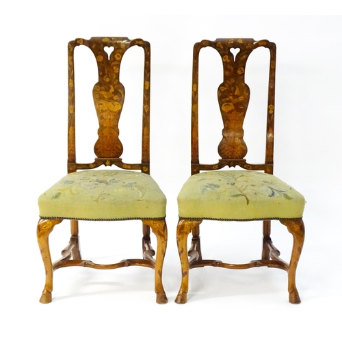 1536 - A pair of early / mid 18thC Dutch side chairs with profusely inlaid walnut frames, the satinwood mar... 
