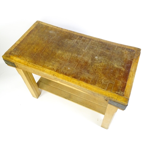 1540 - An early 20thC butchers block on a later stand, the block having corner brackets and raised on a peg... 