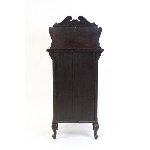 1547 - A late Victorian ebonised side cabinet with a mirrored upstand, a moulded top and a single frieze dr... 