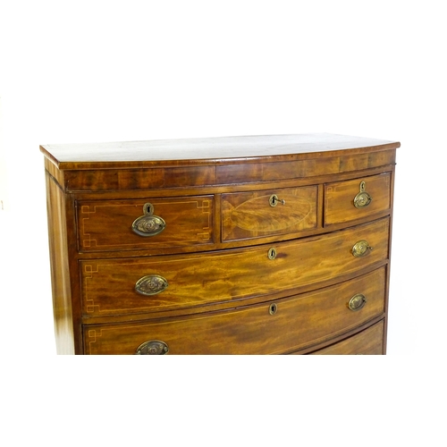 1551 - A mid 19thC mahogany chest of drawers with a bow fronted top above three short over three long drawe... 