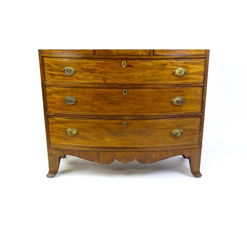 1551 - A mid 19thC mahogany chest of drawers with a bow fronted top above three short over three long drawe... 