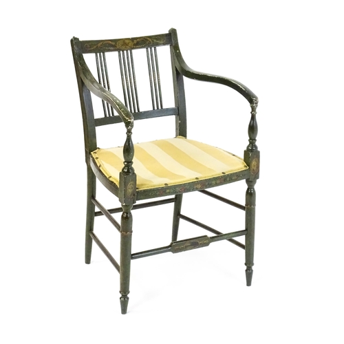 1552 - A Regency elbow chair with a green finish and neo classical painted decoration, raised on turned tap... 