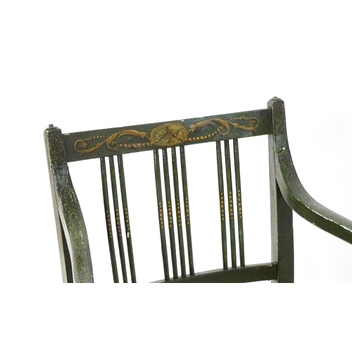 1552 - A Regency elbow chair with a green finish and neo classical painted decoration, raised on turned tap... 