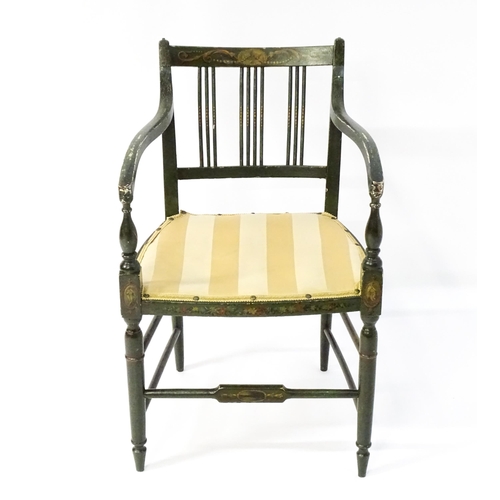 1552 - A Regency elbow chair with a green finish and neo classical painted decoration, raised on turned tap... 