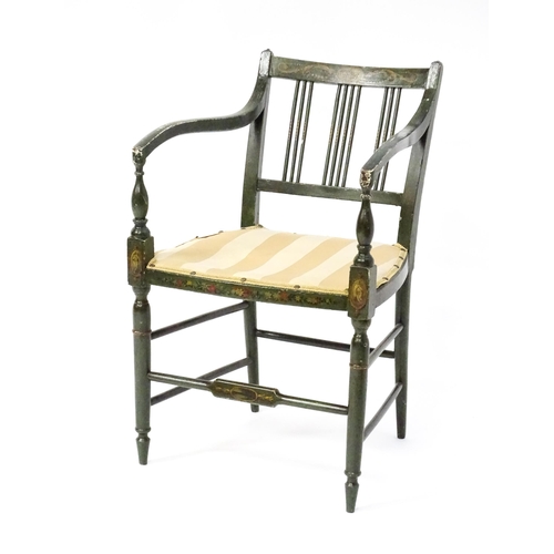 1552 - A Regency elbow chair with a green finish and neo classical painted decoration, raised on turned tap... 