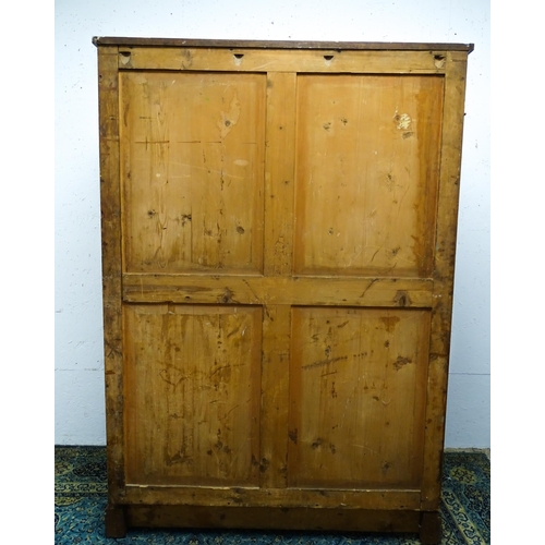 1554 - An early 19thC mahogany linen press with a single long drawer having floral carved knobs above two p... 