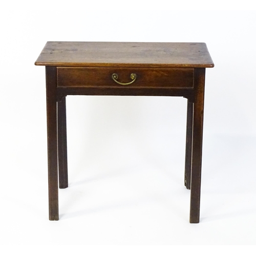 1559 - An 18thC oak side table with a rectangular moulded top above a single frieze drawer and four chamfer... 