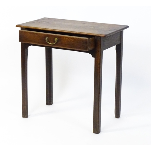 1559 - An 18thC oak side table with a rectangular moulded top above a single frieze drawer and four chamfer... 