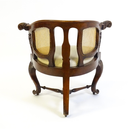 1562 - A mid 19thC mahogany Bürgermeister chair, this continental chair having a bowed backrest terminating... 