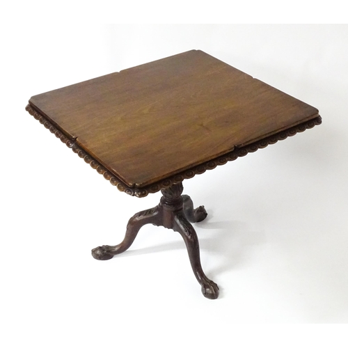 1568 - A mid / late 18thC mahogany tilt top table with an unusual moulded surround, re-entrant corners and ... 