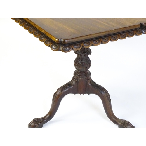 1568 - A mid / late 18thC mahogany tilt top table with an unusual moulded surround, re-entrant corners and ... 