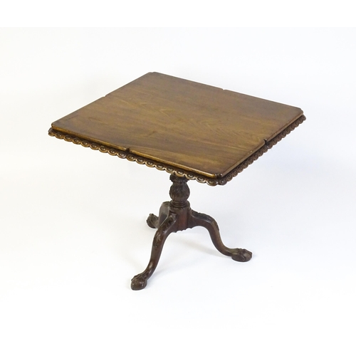 1568 - A mid / late 18thC mahogany tilt top table with an unusual moulded surround, re-entrant corners and ... 