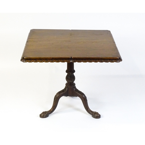 1568 - A mid / late 18thC mahogany tilt top table with an unusual moulded surround, re-entrant corners and ... 