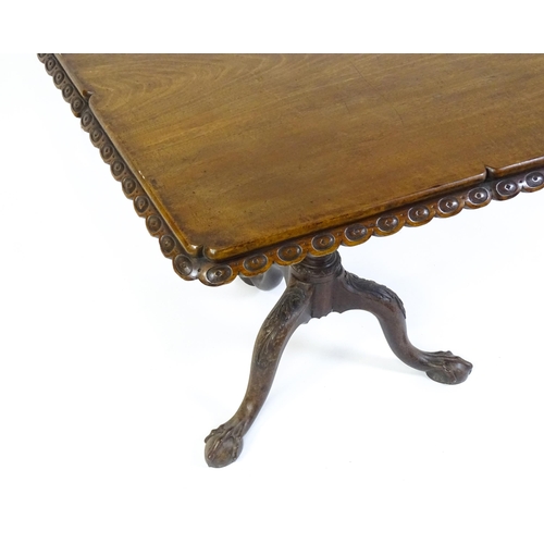 1568 - A mid / late 18thC mahogany tilt top table with an unusual moulded surround, re-entrant corners and ... 