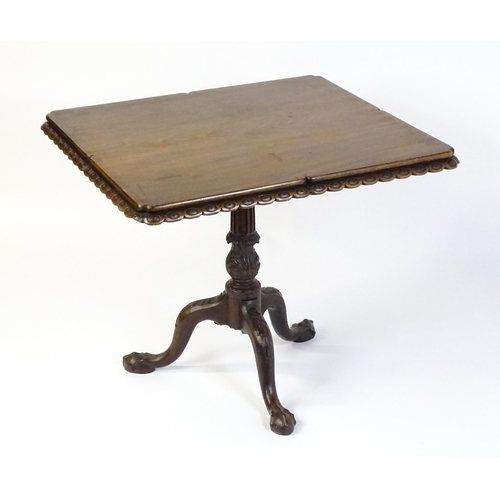 1568 - A mid / late 18thC mahogany tilt top table with an unusual moulded surround, re-entrant corners and ... 