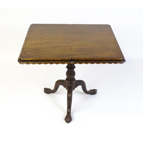 1568 - A mid / late 18thC mahogany tilt top table with an unusual moulded surround, re-entrant corners and ... 