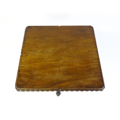 1568 - A mid / late 18thC mahogany tilt top table with an unusual moulded surround, re-entrant corners and ... 