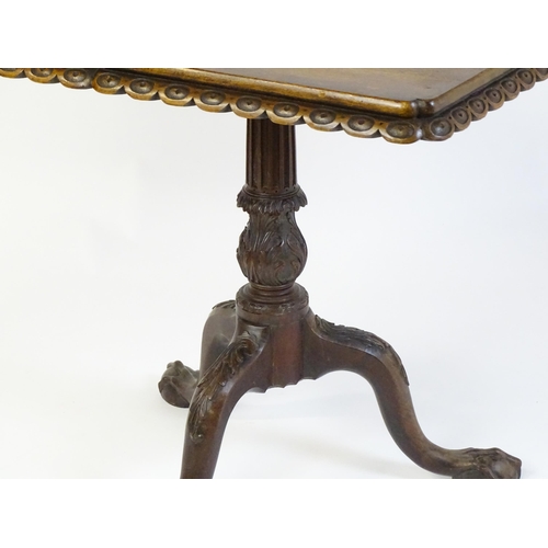 1568 - A mid / late 18thC mahogany tilt top table with an unusual moulded surround, re-entrant corners and ... 