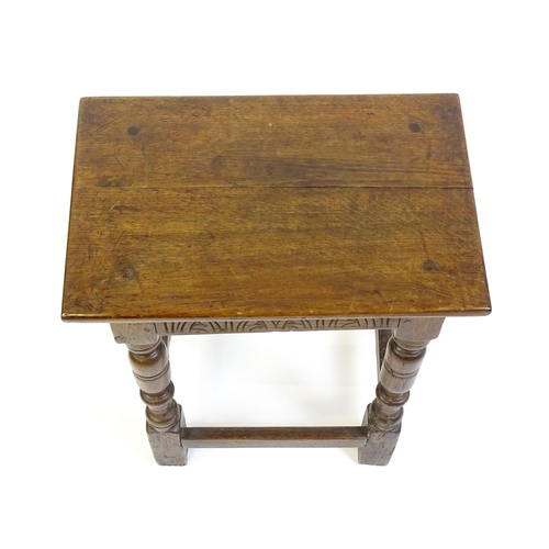 1574 - A 19thC peg jointed oak stool with a rectangular top above four turned tapering legs united by a box... 