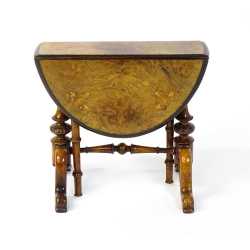 1580 - A late 19thC walnut veneered Sutherland table with two demi lune drop leaves raised on two turned an... 