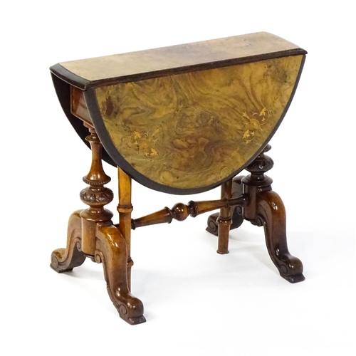 1580 - A late 19thC walnut veneered Sutherland table with two demi lune drop leaves raised on two turned an... 