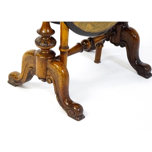 1580 - A late 19thC walnut veneered Sutherland table with two demi lune drop leaves raised on two turned an... 