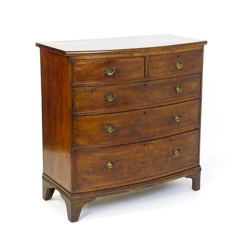 1582 - A late 19thC mahogany bow fronted chest of drawers comprising two short over three long drawers rais... 