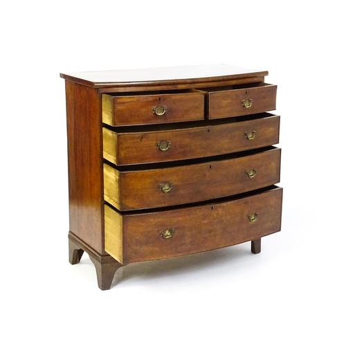 1582 - A late 19thC mahogany bow fronted chest of drawers comprising two short over three long drawers rais... 