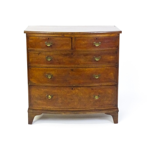 1582 - A late 19thC mahogany bow fronted chest of drawers comprising two short over three long drawers rais... 