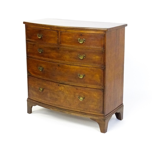 1582 - A late 19thC mahogany bow fronted chest of drawers comprising two short over three long drawers rais... 