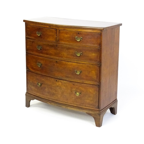 1582 - A late 19thC mahogany bow fronted chest of drawers comprising two short over three long drawers rais... 