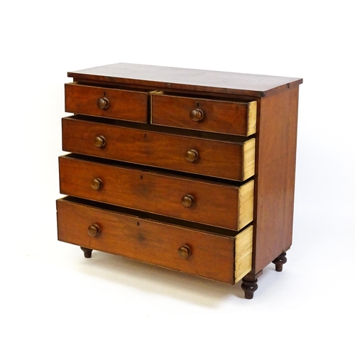 1585 - A Victorian mahogany chest of drawers with two short over three long drawers with turned wooden hand... 