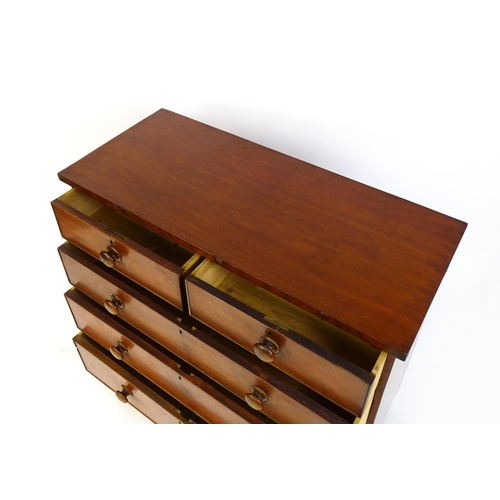 1585 - A Victorian mahogany chest of drawers with two short over three long drawers with turned wooden hand... 