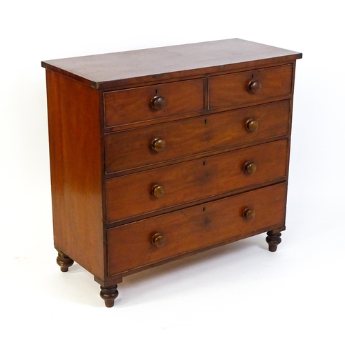 1585 - A Victorian mahogany chest of drawers with two short over three long drawers with turned wooden hand... 