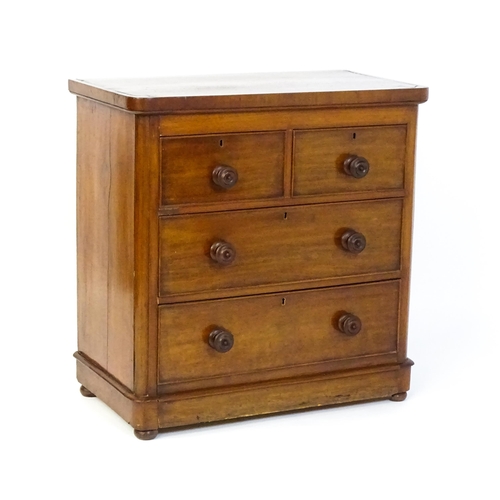 1589 - A Victorian mahogany chest of drawers with a veneered oblong top above two short over two drawers wi... 