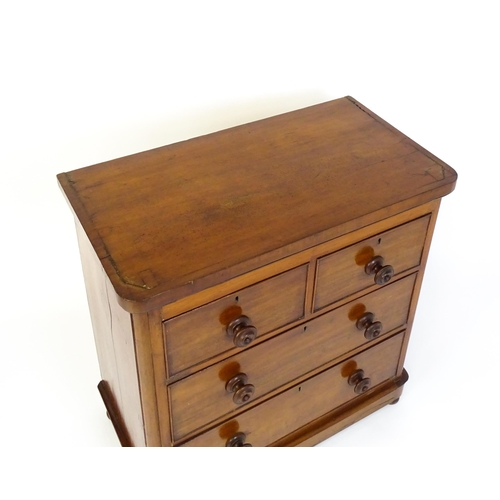 1589 - A Victorian mahogany chest of drawers with a veneered oblong top above two short over two drawers wi... 