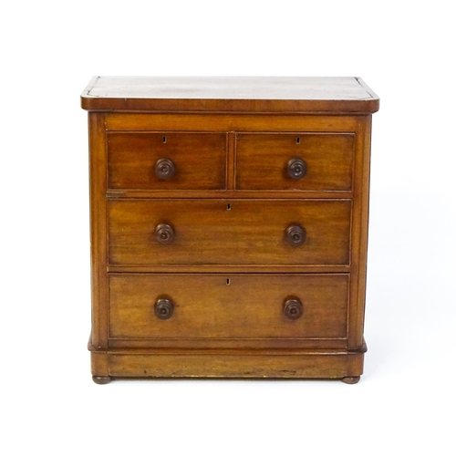 1589 - A Victorian mahogany chest of drawers with a veneered oblong top above two short over two drawers wi... 