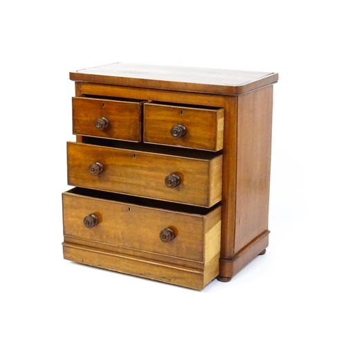 1589 - A Victorian mahogany chest of drawers with a veneered oblong top above two short over two drawers wi... 