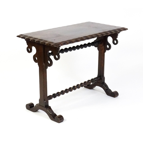 1592 - A 19thC mahogany side table with a double moulded rectangular top above two chamfered platform suppo... 