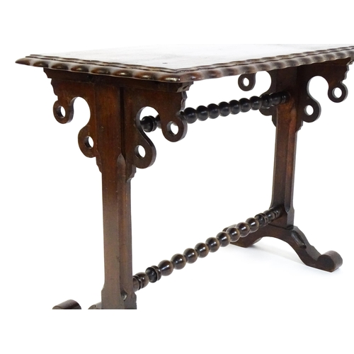 1592 - A 19thC mahogany side table with a double moulded rectangular top above two chamfered platform suppo... 