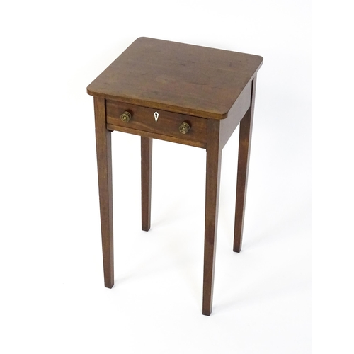 1593 - A late Georgian mahogany side table with a small frieze drawer, bone escutcheon, brass knob handles ... 