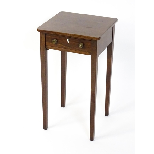 1593 - A late Georgian mahogany side table with a small frieze drawer, bone escutcheon, brass knob handles ... 