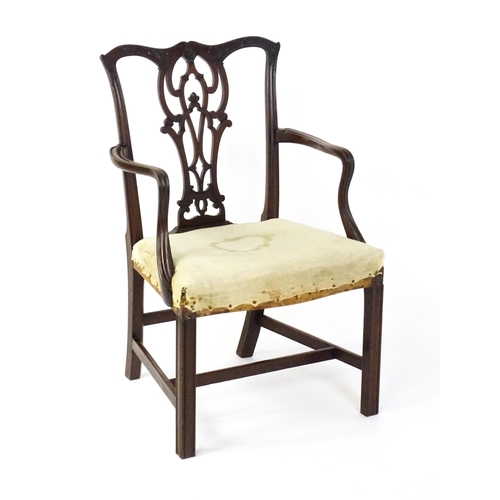 1596 - An early 20thC mahogany Chippendale elbow chair with a shaped top rail, a pierced and carved vase sh... 