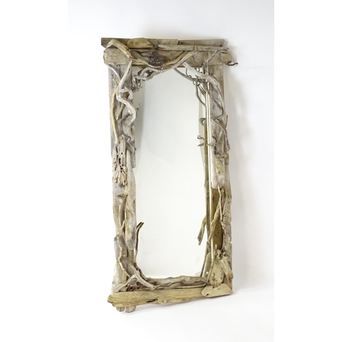 1598 - An early 20thC driftwood mirror. 64