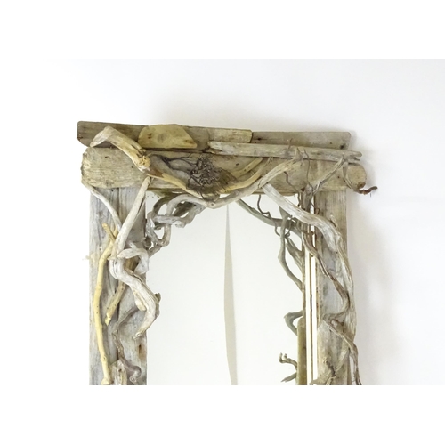 1598 - An early 20thC driftwood mirror. 64