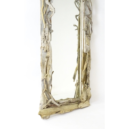 1598 - An early 20thC driftwood mirror. 64